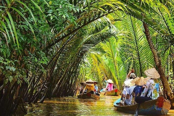 BIG BOSS private LIMOUSINE DAY TRIP TO MEKONG DElTA - A large boat and the waterways near Ben Tre