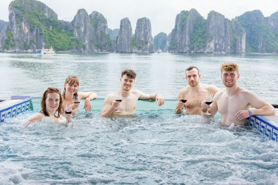 From Hanoi: 1-Day Halong 5-Star Cruise w/Jacuzzi & Limousine - Titop Island, swimming, and the best view of the bay
